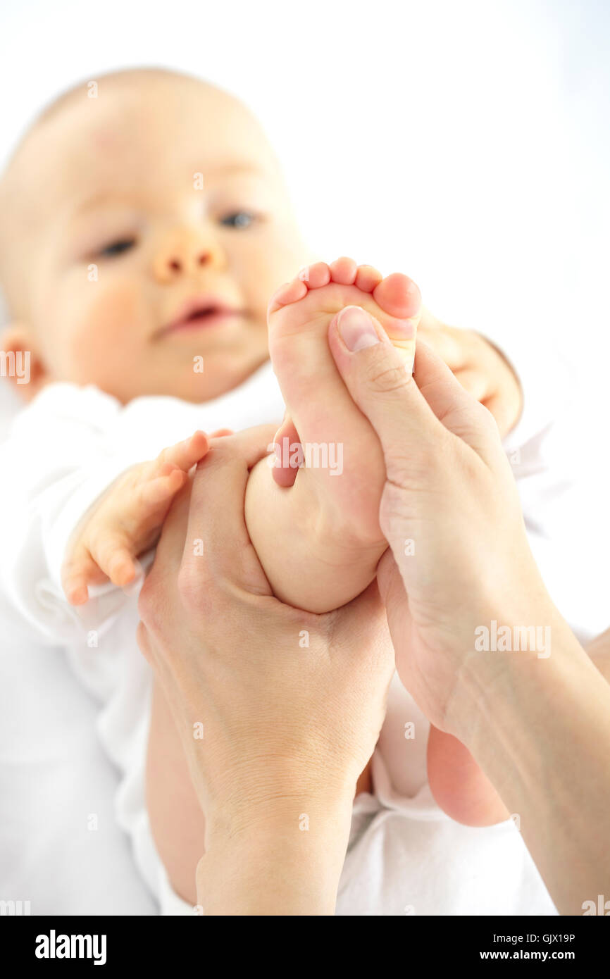 baby foot massage Stock Photo Alamy