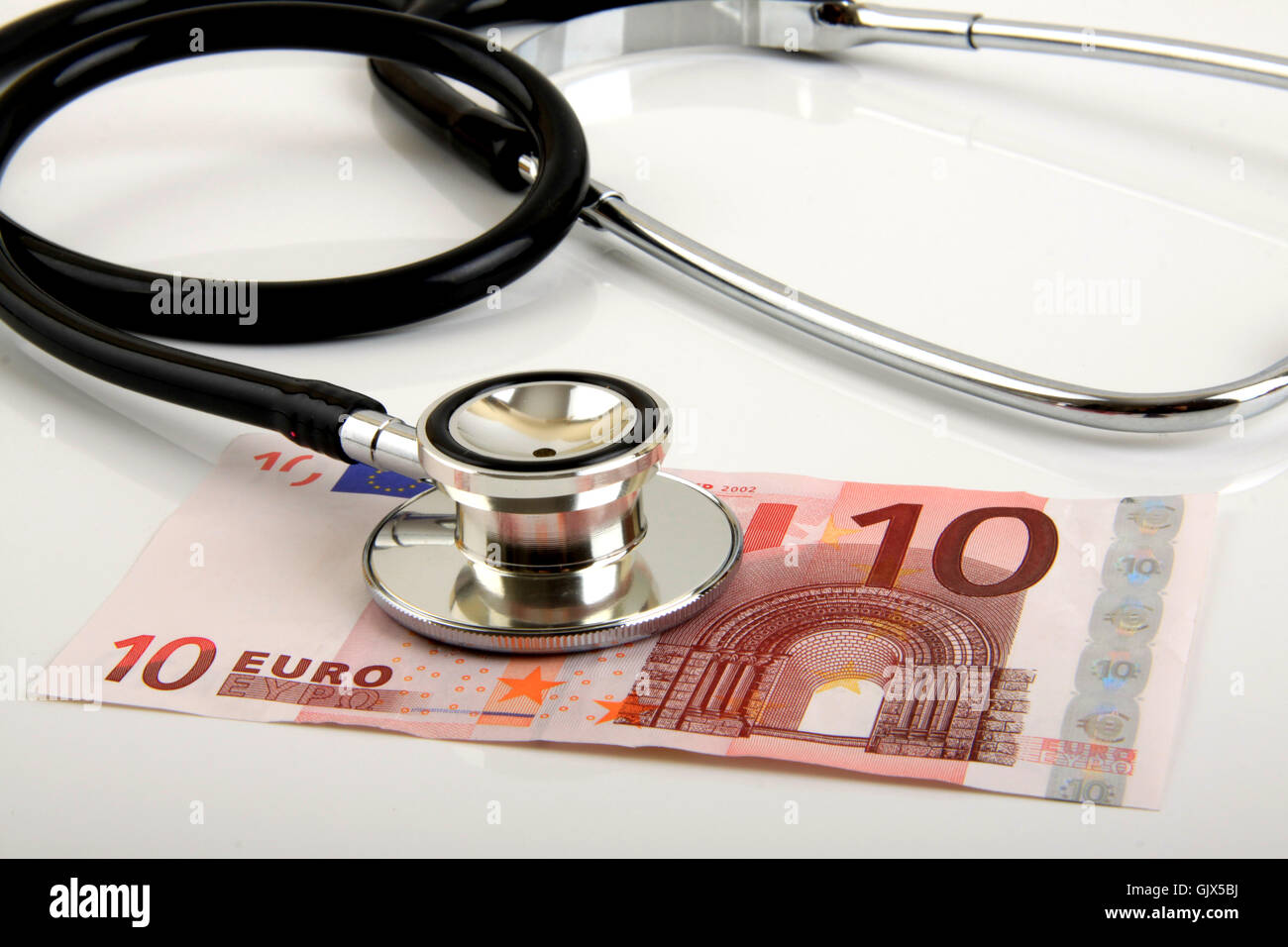 sickness fund cost stethoscope Stock Photo