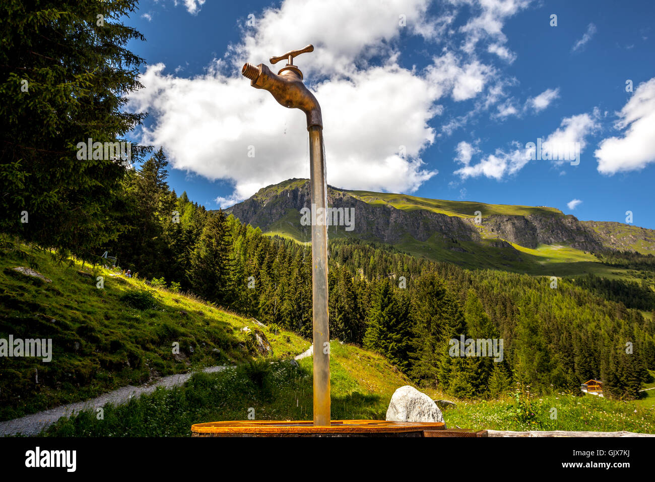 Monument Faucet at a natural water spring in Hintertux, Austria Stock Photo