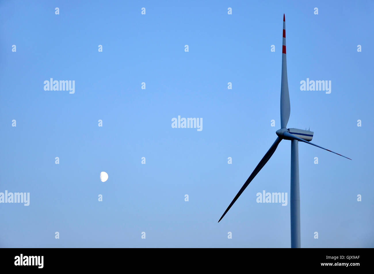 moon and wind turbine against the blue sky Stock Photo - Alamy