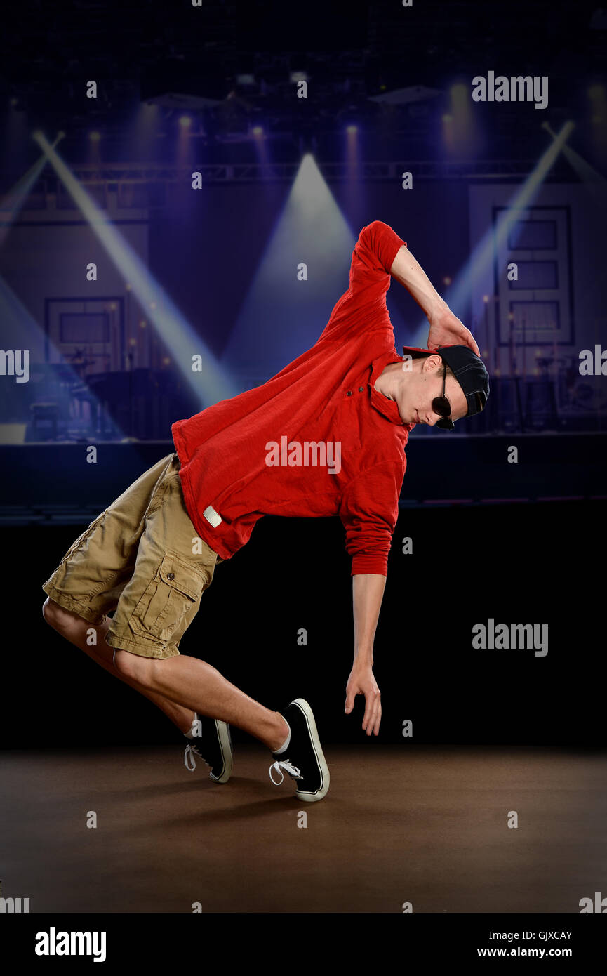 Young hip hop dancer performing on stage Stock Photo
