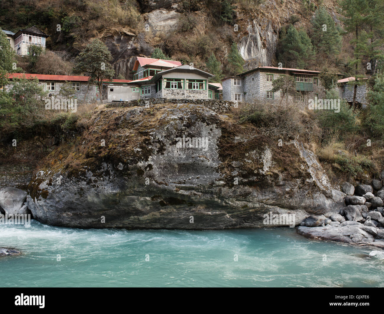 The river rushes through the mountain village of Phakding in Nepal's Everest Base Camp Stock Photo