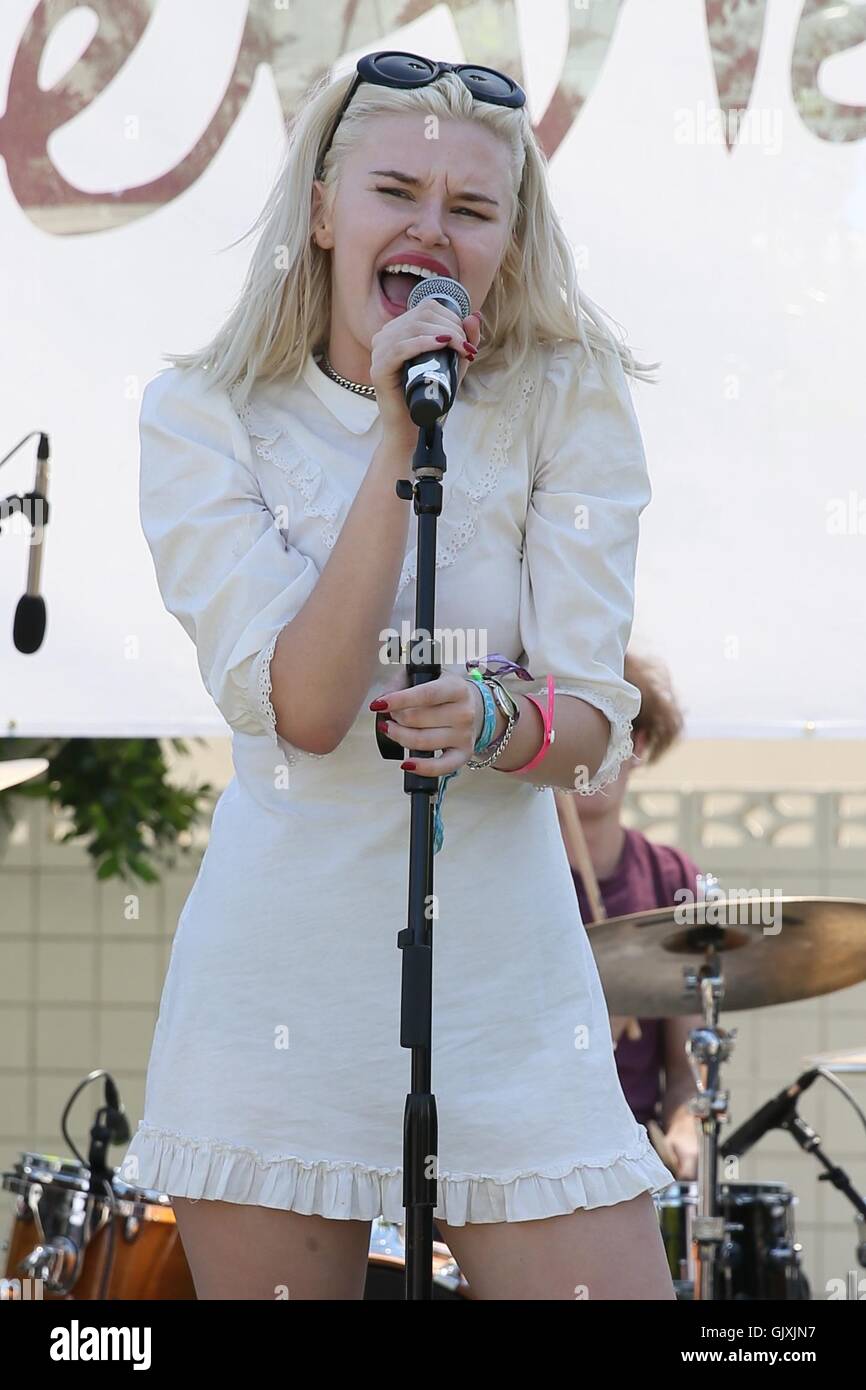 Grace McKagan and her band The Pink Slips perform on stage at the party