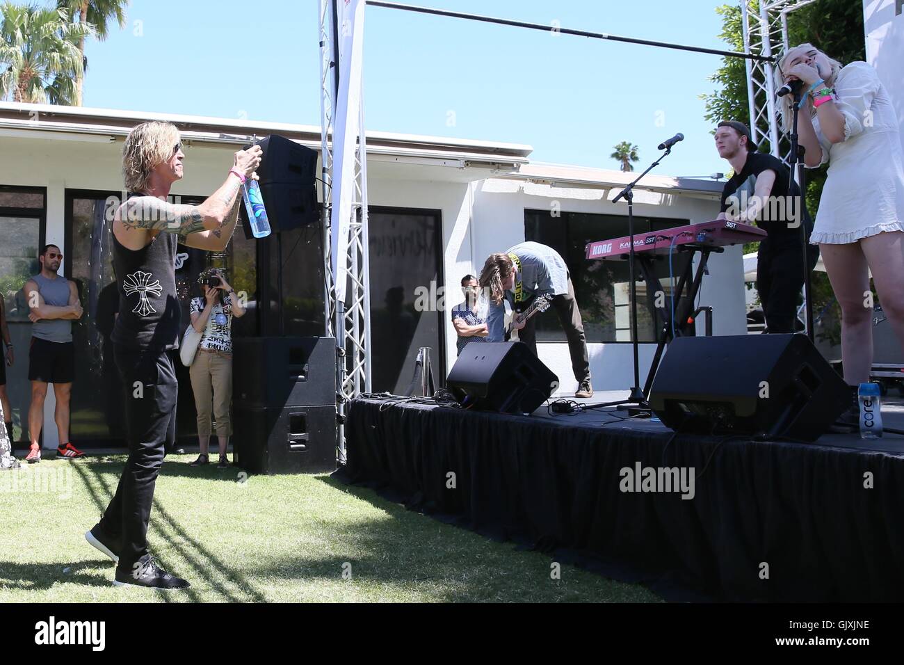 Grace McKagan and her band The Pink Slips perform on stage at the party