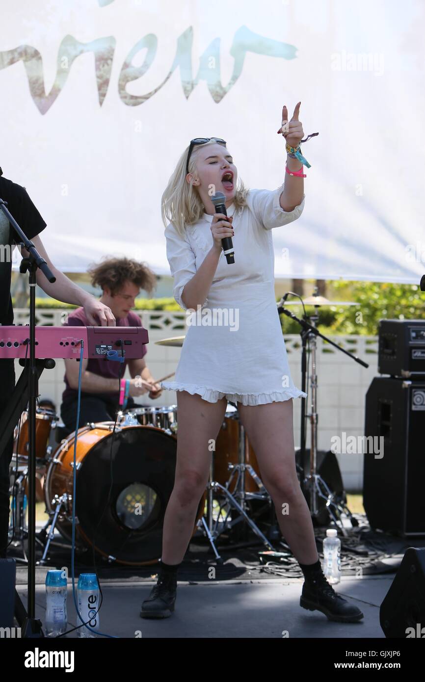 Grace McKagan and her band The Pink Slips perform on stage at the party