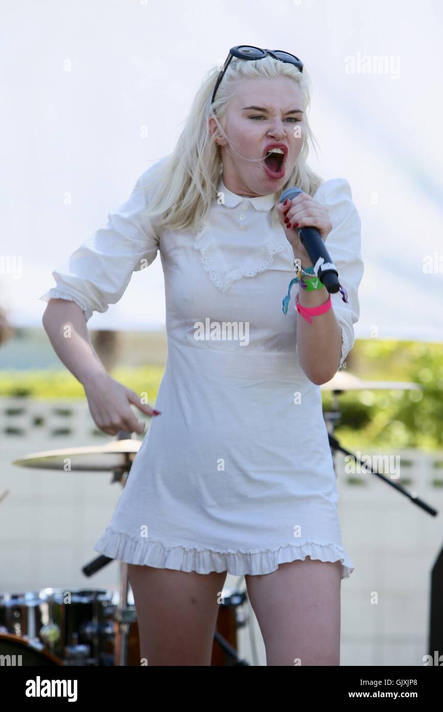 Grace McKagan and her band The Pink Slips perform on stage at the party