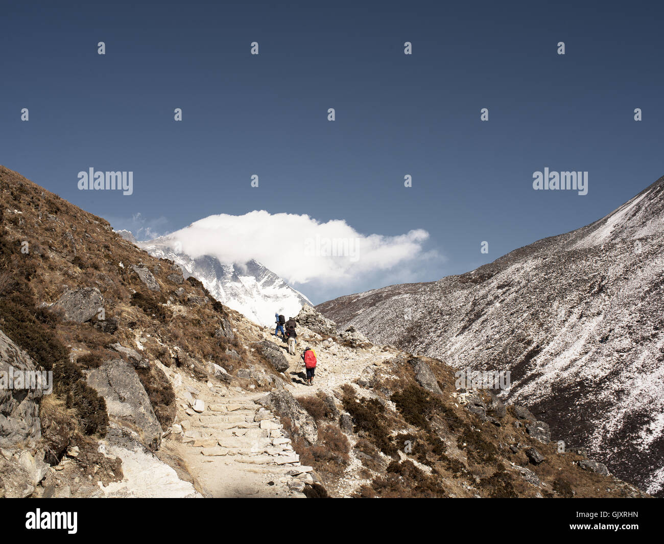 Hikers make their way up steps in Nepal's Everest Base Camp Stock Photo