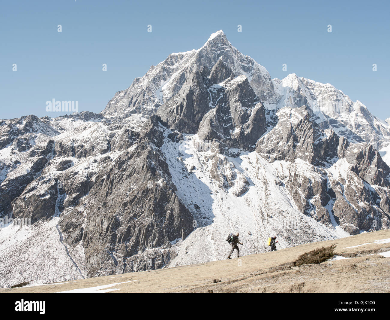 Hikers near Lobuche, Nepal make their way through Everest Base Camp Stock Photo