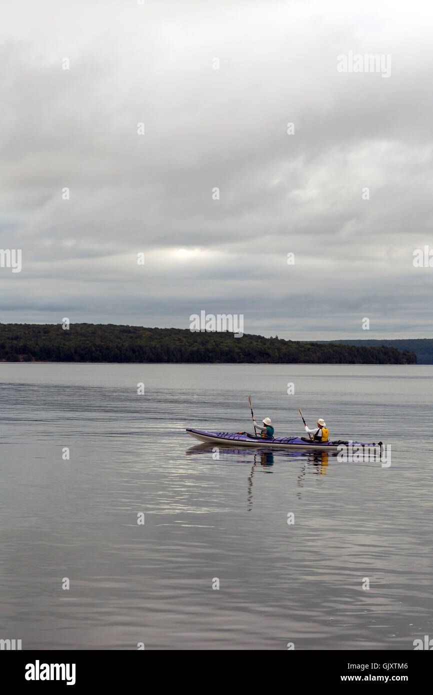 Munising, Michigan - Kayakers in Lake Superior at Grand Island National Recreation Area. Stock Photo
