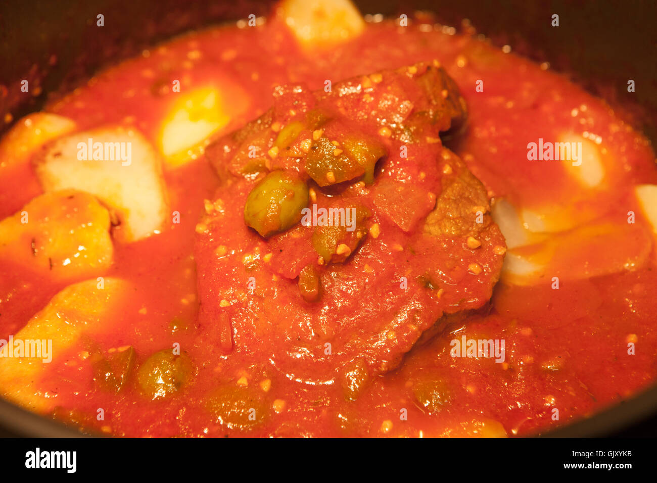 Boliche Cuban Pot roast with Potatoes and green olives in red sauce