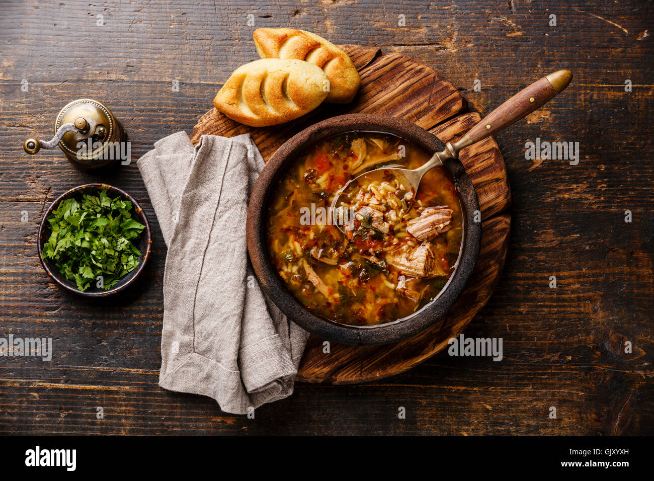 Traditional Georgian soup Kharcho with meat and rice on wooden