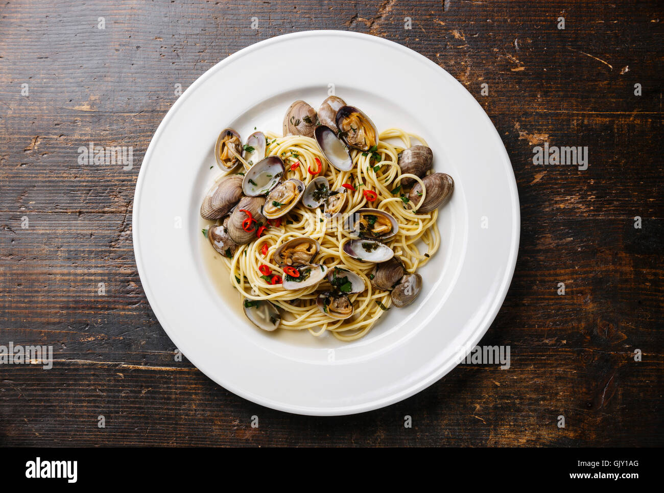 Spaghetti alle Vongole Seafood pasta with clams on white plate Stock Photo