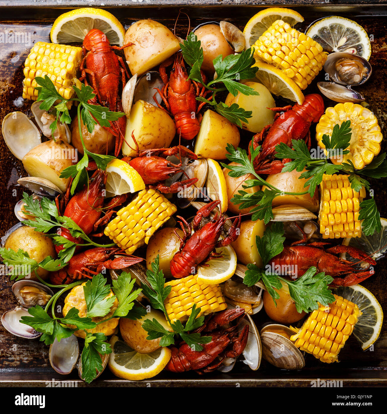 Clambake Seafood boil with boiled Crayfish, Corn on the Cob, Potatoes and Clams Stock Photo