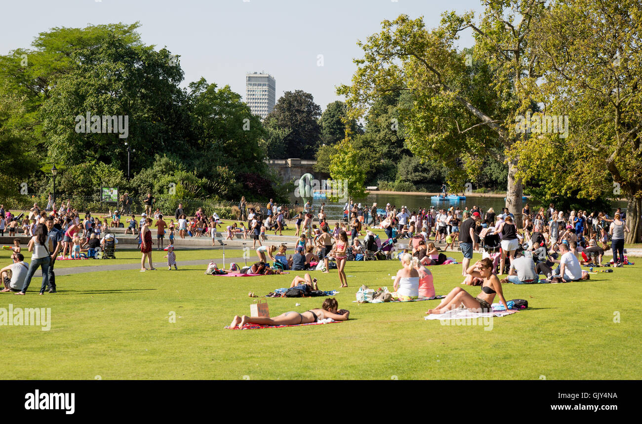 Tourists enjoying the Diana Memorial Fountain Hyde Park London UK Stock Photo