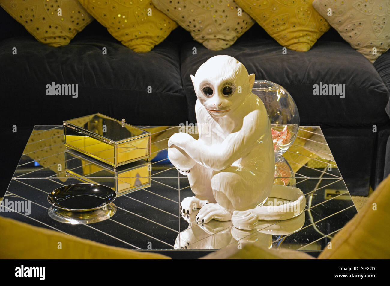 A slightly creepy ceramic monkey on a mirrored table in the media room at Elvis Presley's Graceland home and museum in Memphis. Stock Photo