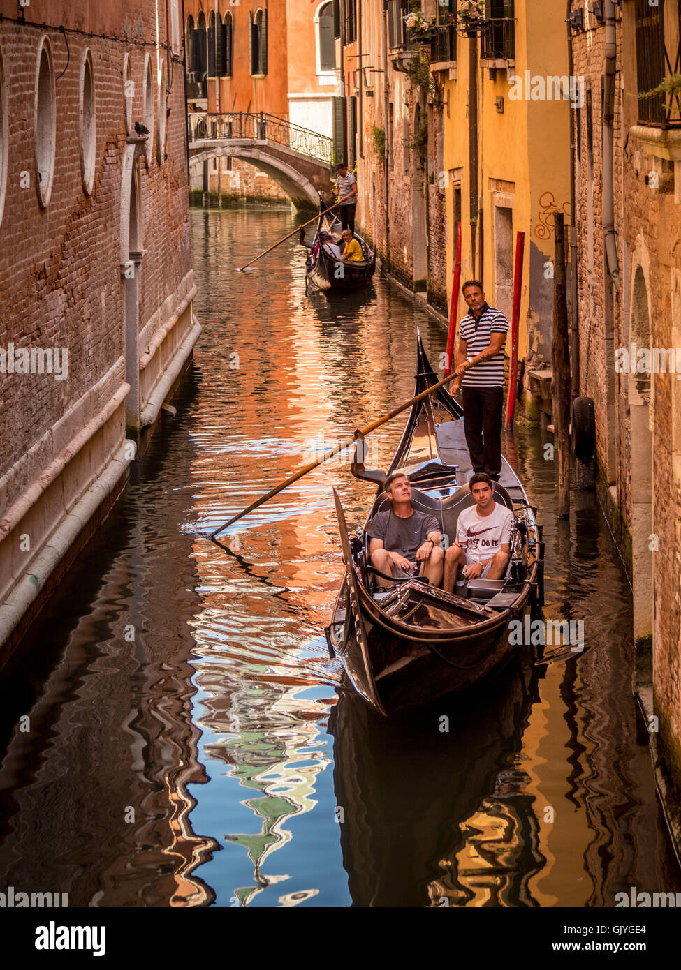 Gondolas on a narrow canal Venice, Italy. Stock Photo