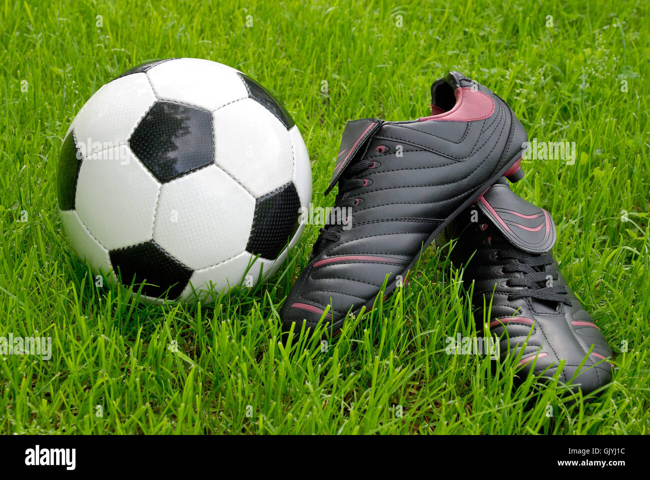 Football ball and shoes hi-res stock photography and images - Alamy