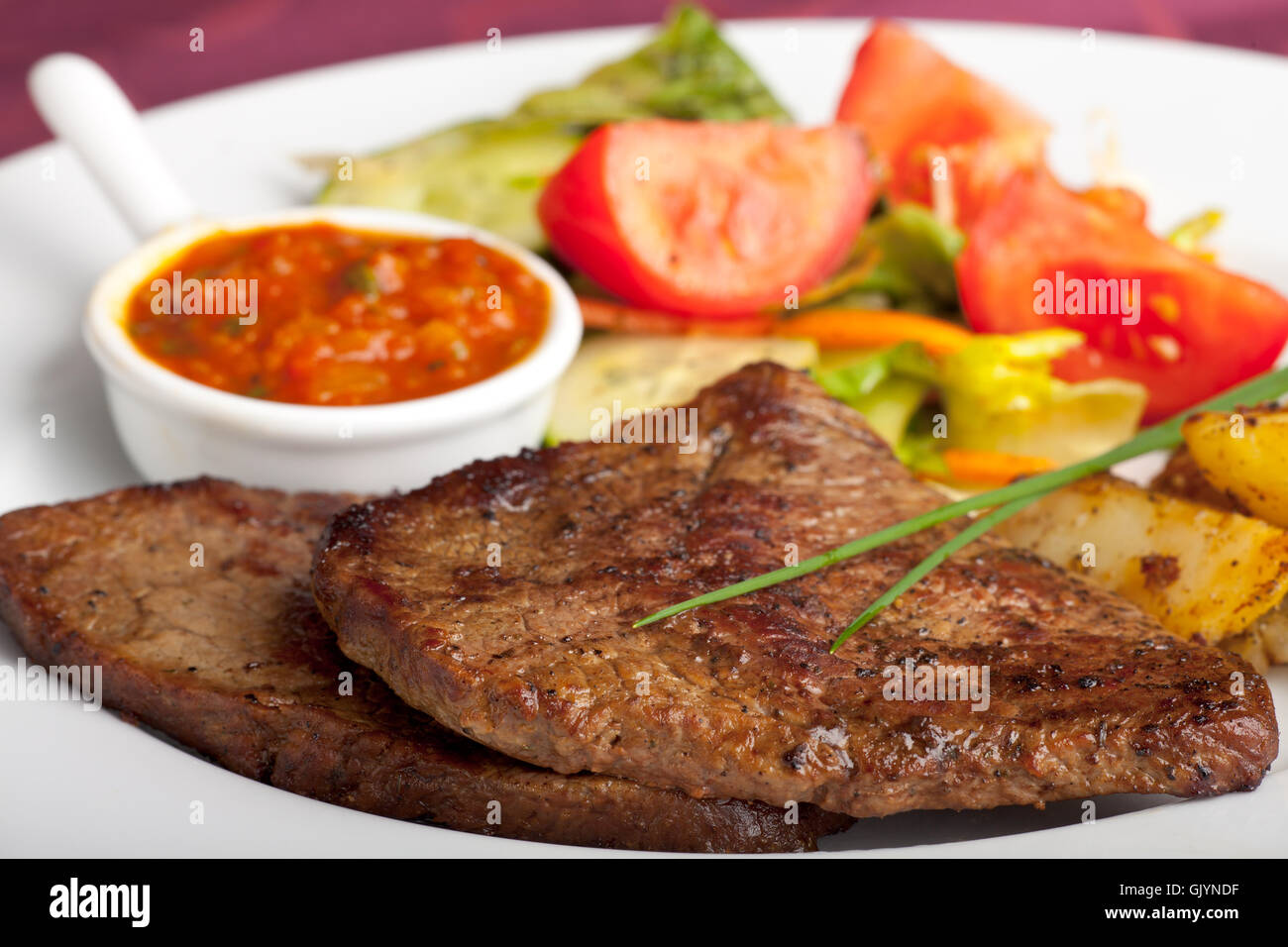 steak with ketchup and potatoes Stock Photo Alamy