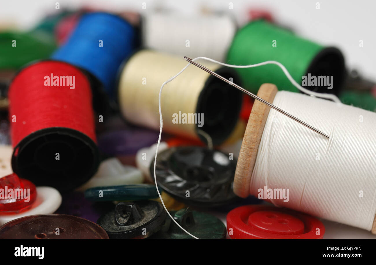 Needle and a thread Stock Photo - Alamy