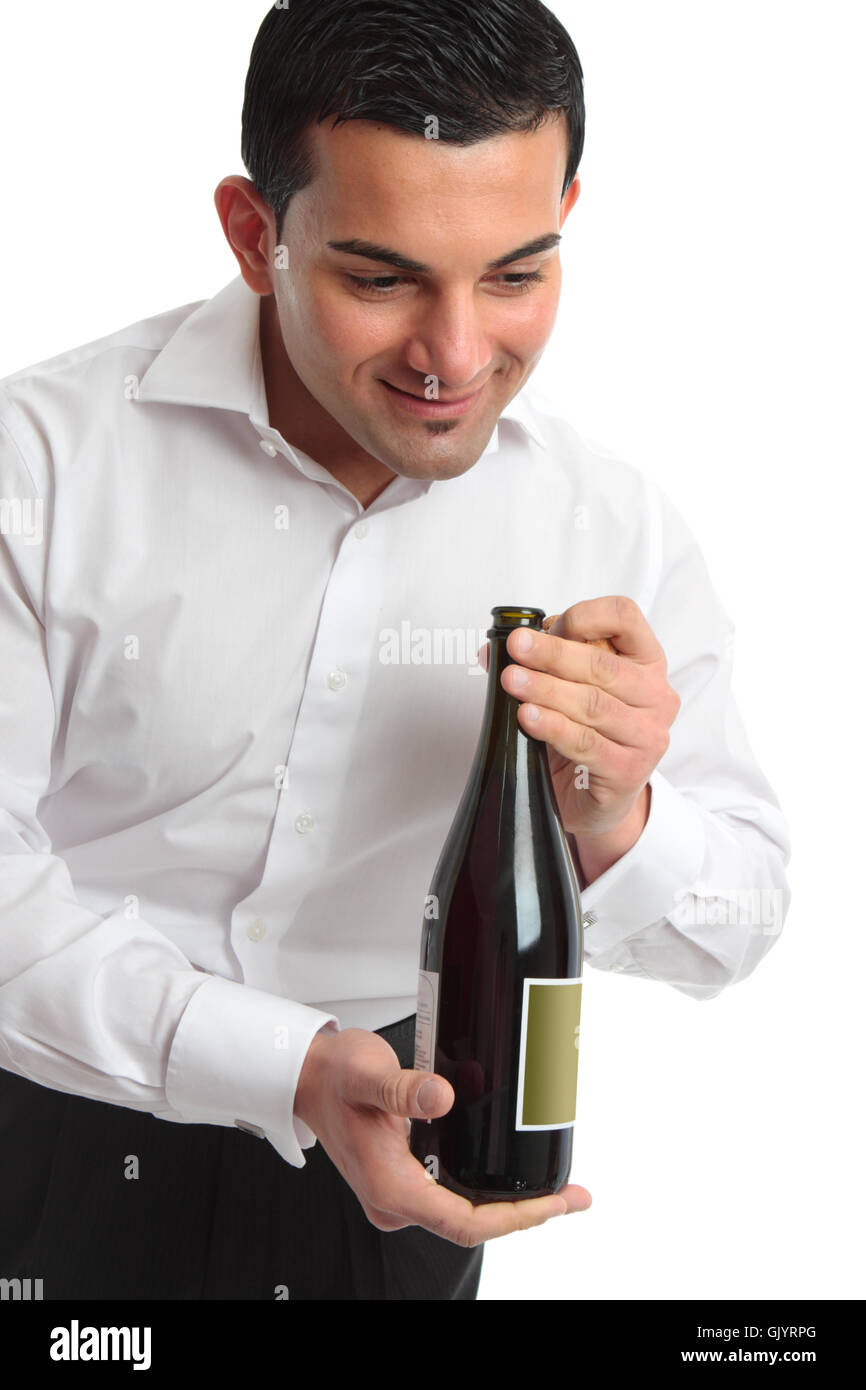 Waiter presenting bottle of wine Stock Photo