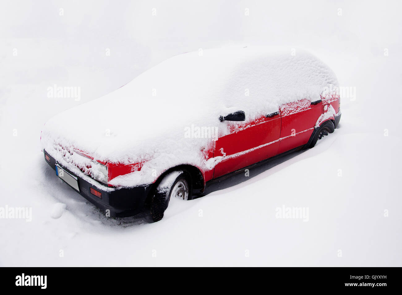 red car in snow Stock Photo Alamy