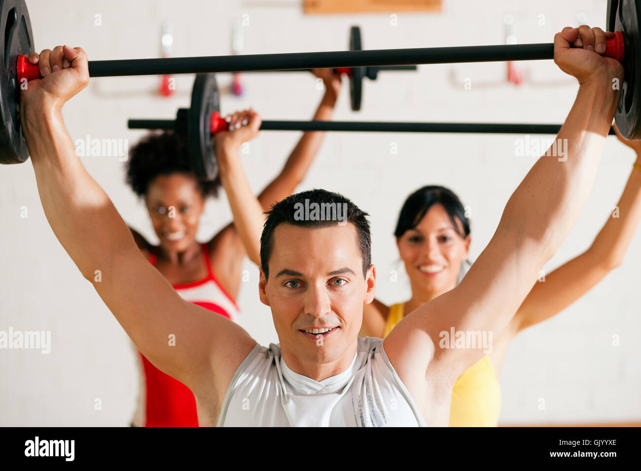 with barbell in gym Stock Photo Alamy