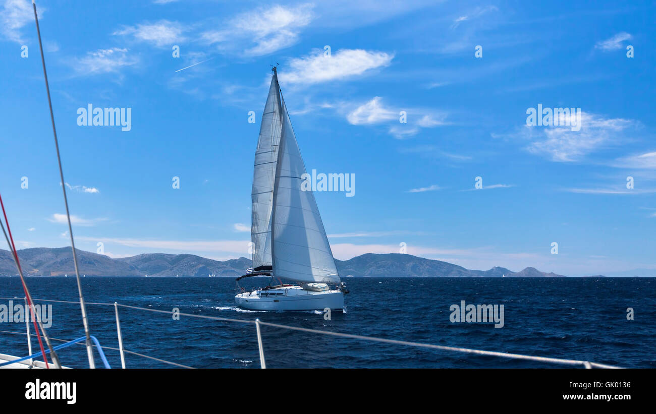 Sailing regatta in the wind through the waves. Luxury yachts Stock ...