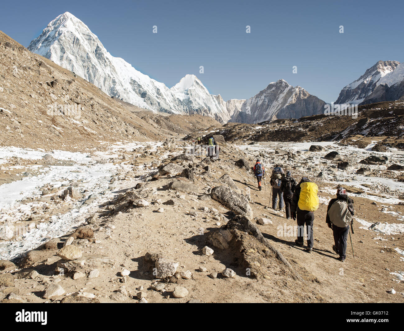 Backpackers follow the Everest Base Camp trail near Lobuche, Nepal Stock Photo