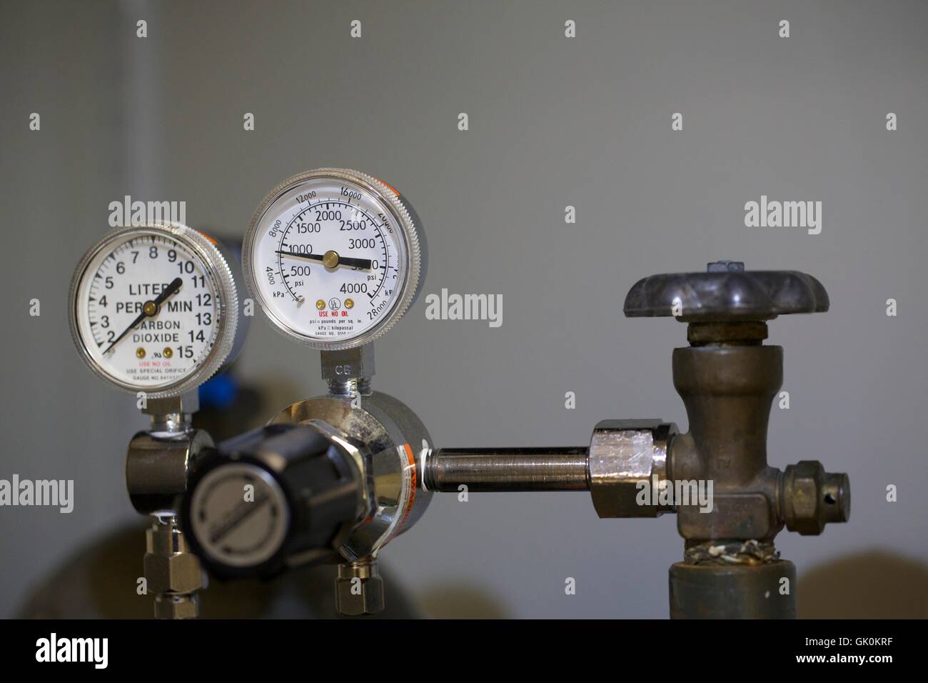 Pressure gauge and valve on carbon dioxide tank. Stock Photo