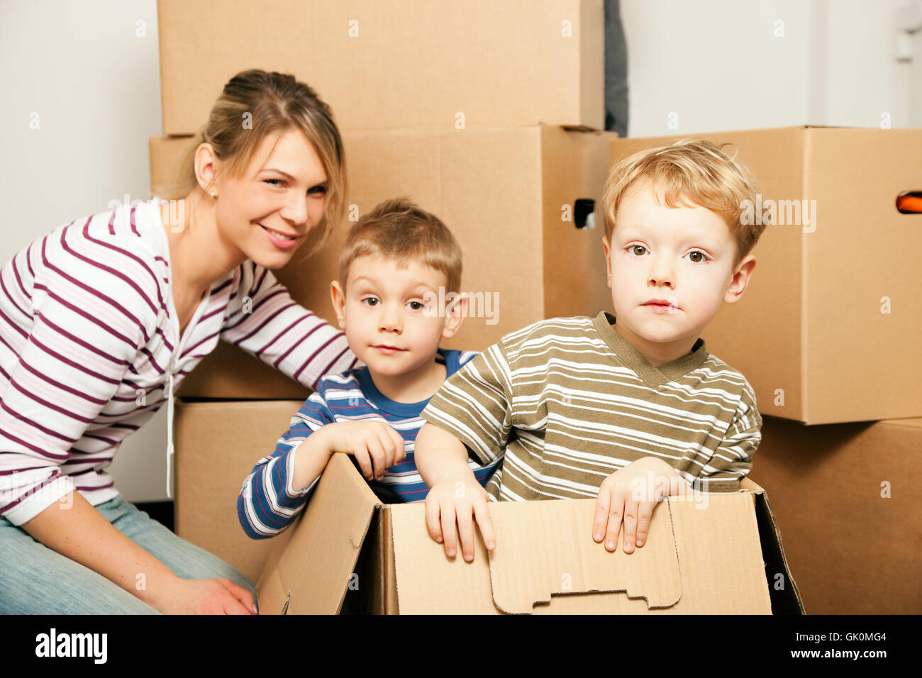 family is moving into their new house Stock Photo