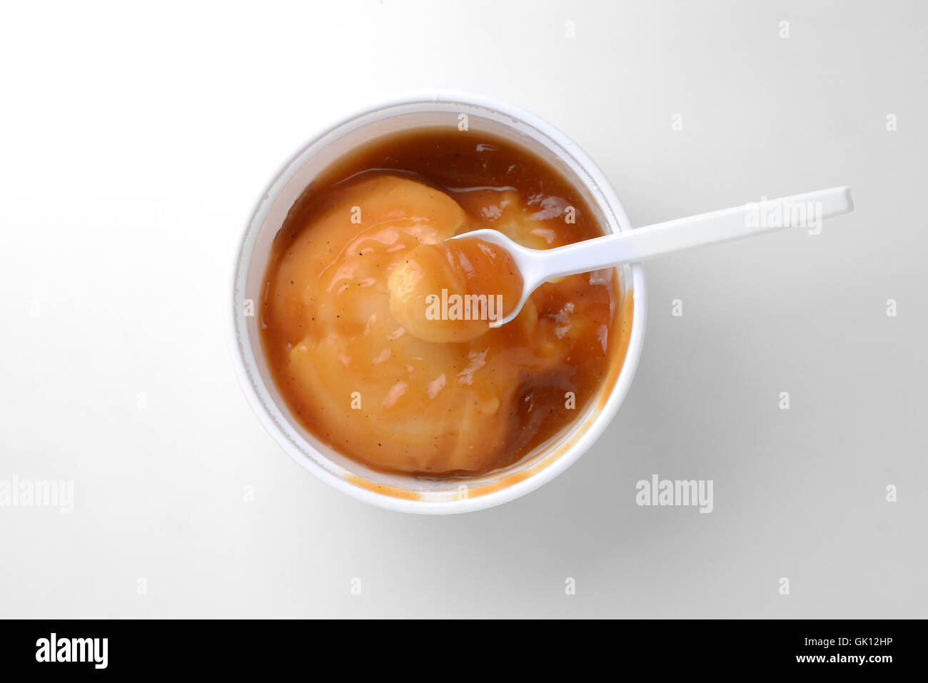 mashed potato with gravy and spoon Stock Photo