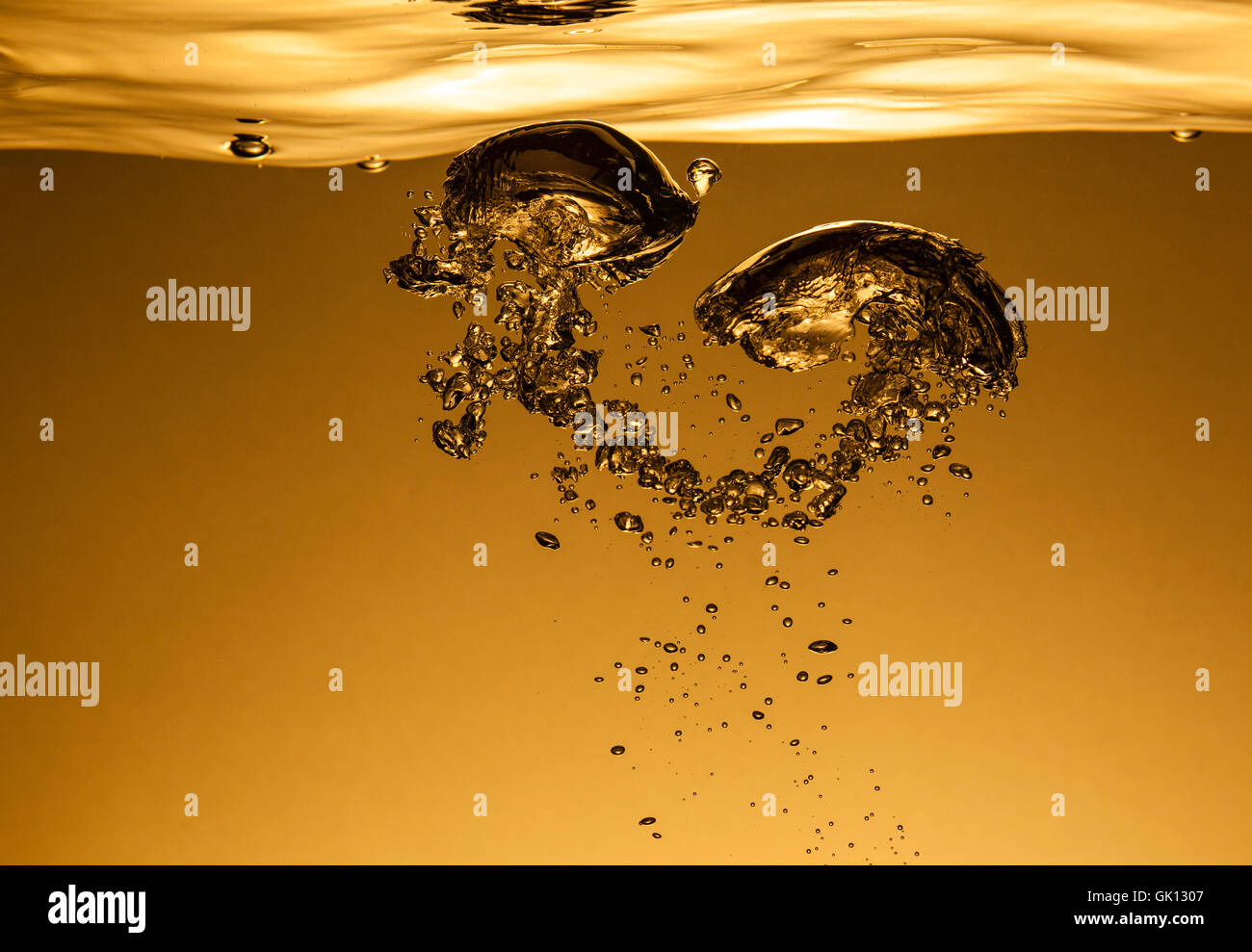 Air bubbles in water, similar to the liquid gold Stock Photo Alamy