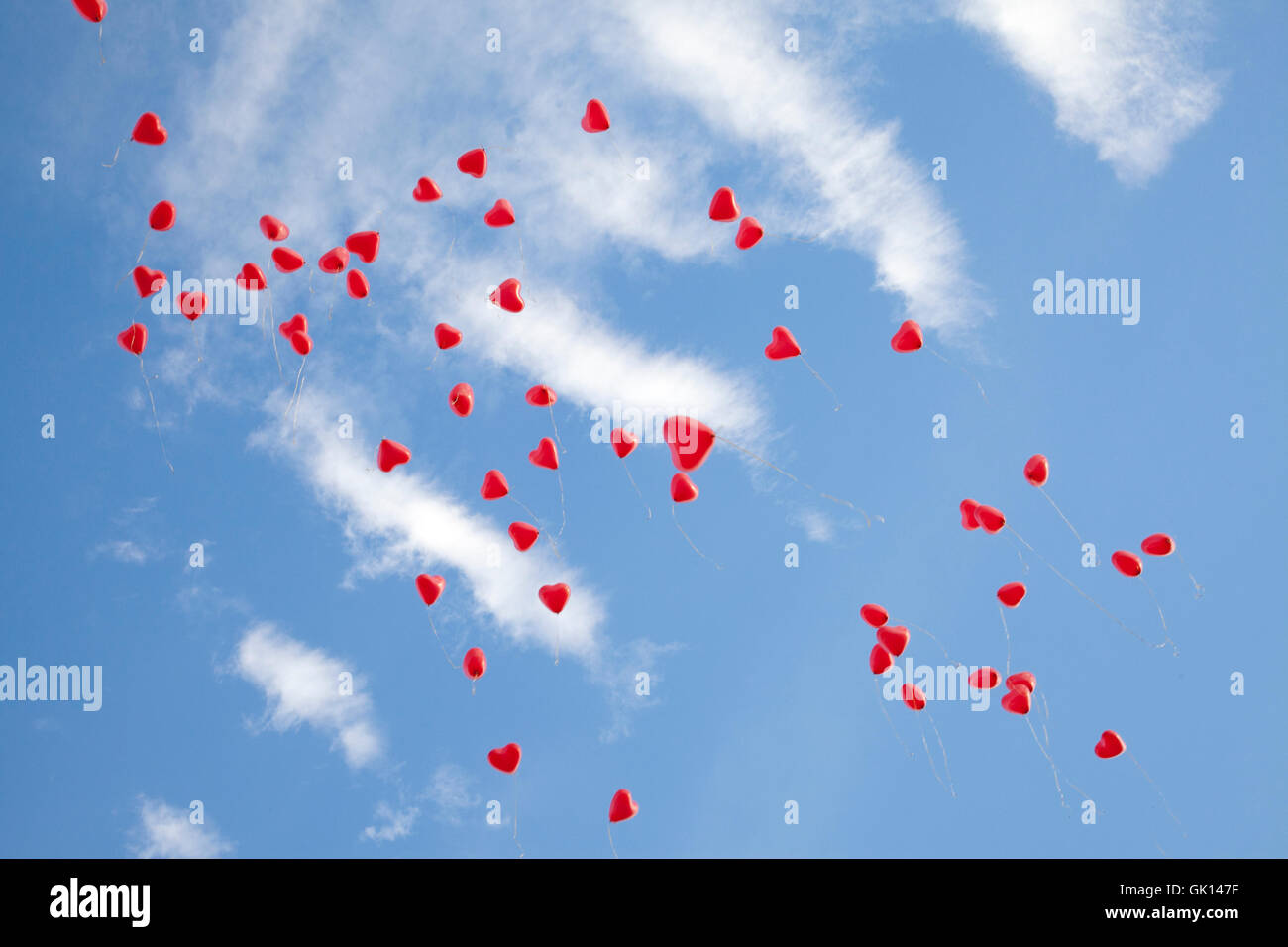 heart balloons on blue sky Stock Photo - Alamy