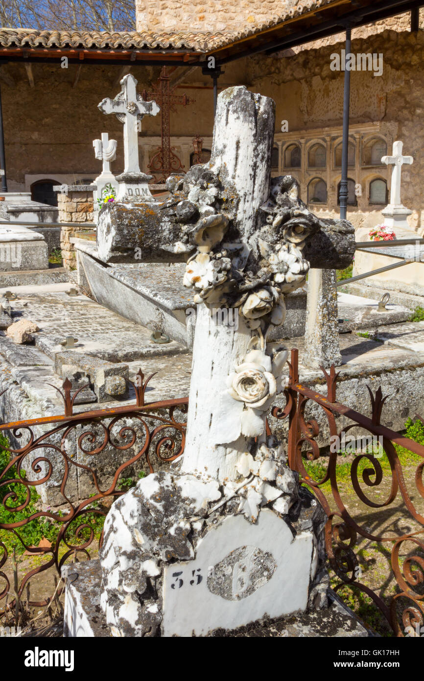 old cross carved in stone on a grave Stock Photo