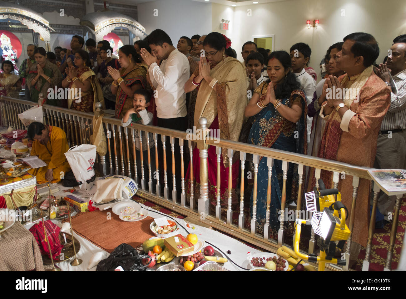 Worship at Hindu temple in 'Little India' in Queens, New York, 2013. Stock Photo