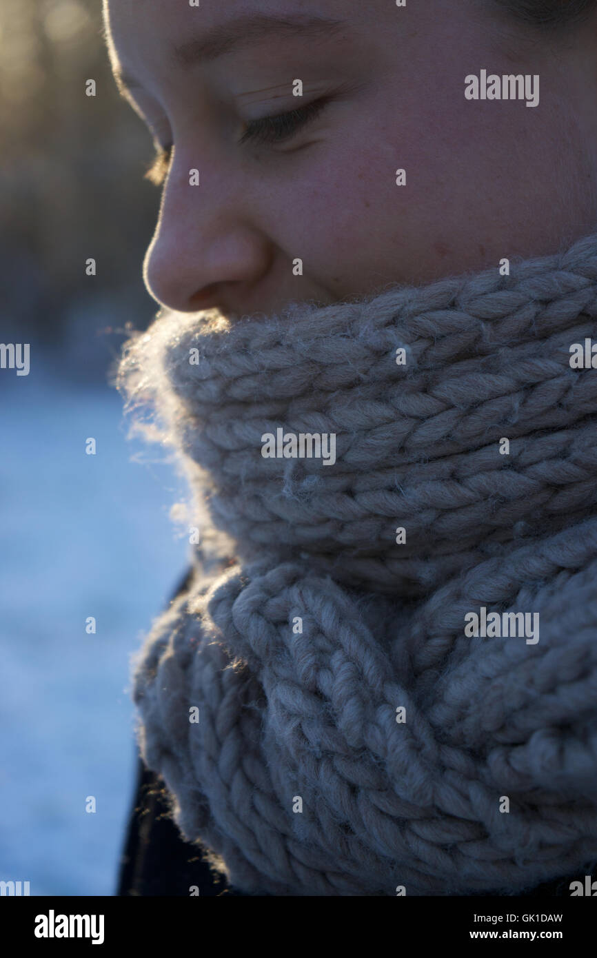 woman wearing knitted scarf. winter, face, cold, woollen. Stock Photo