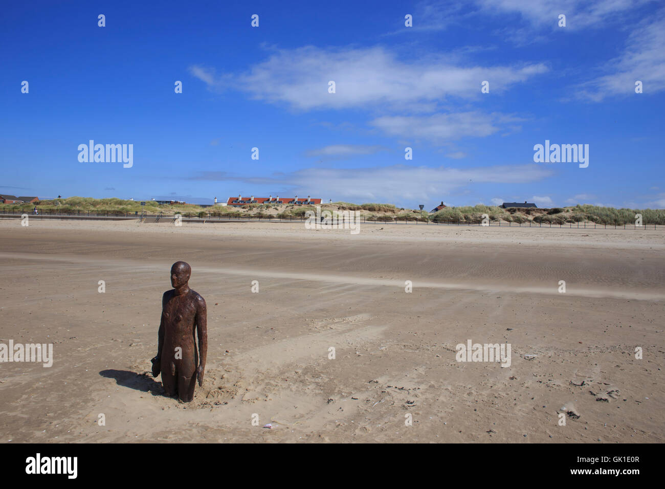 One of Antony Gormley's 'Another Place' sculptures on the beach at