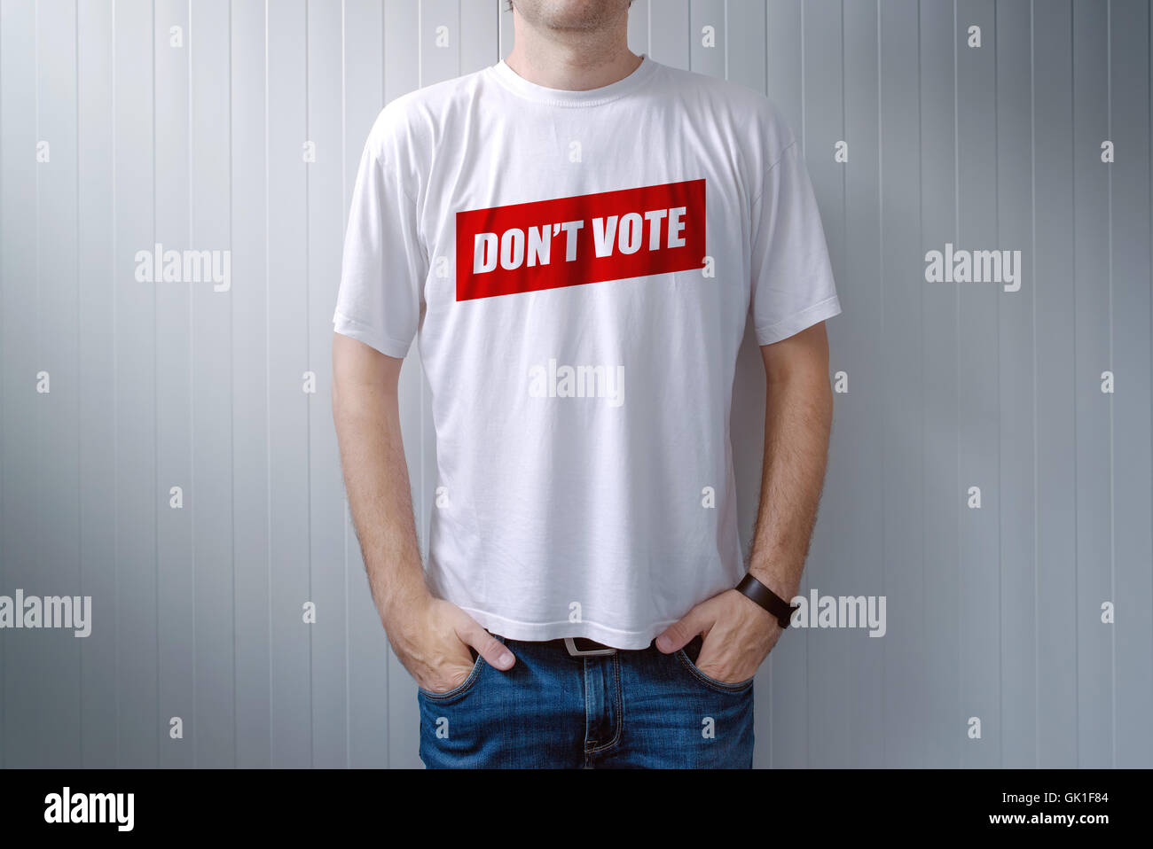 Handsome man wearing shirt with Don't vote title printed on chest, express attitude and opinion on political elections Stock Photo