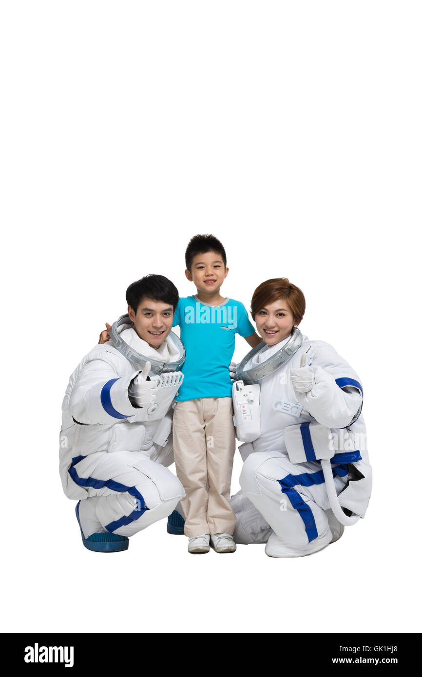 Studio shot astronauts and the little boy Stock Photo