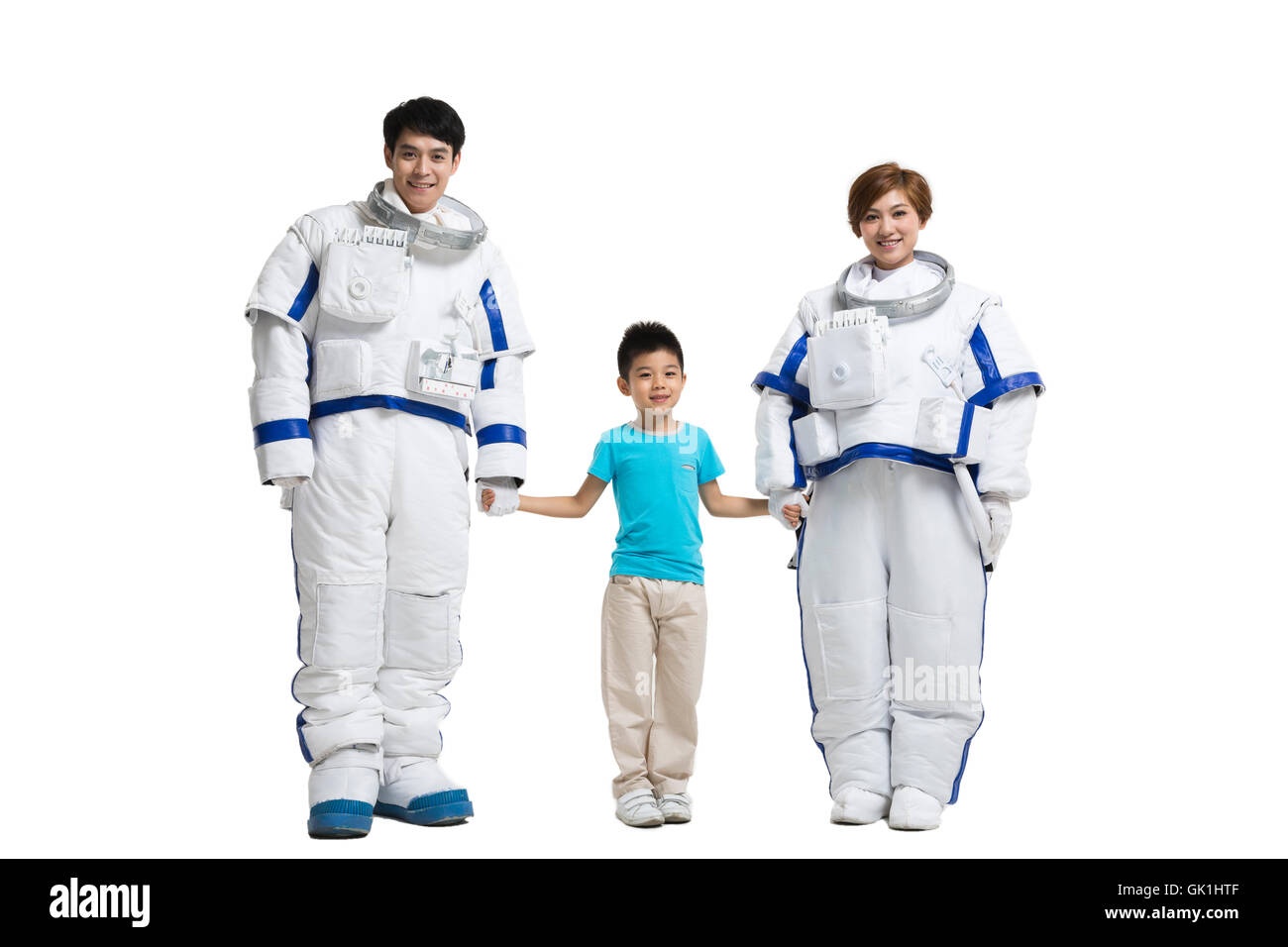 Studio shot astronauts and the little boy Stock Photo