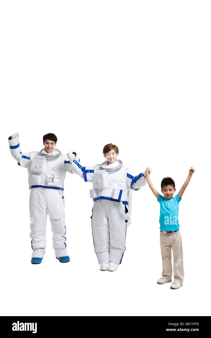 Studio shot astronauts and the little boy Stock Photo