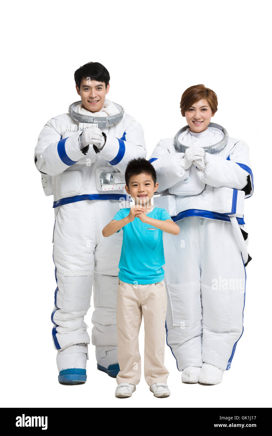 Studio shot astronauts and the little boy Stock Photo