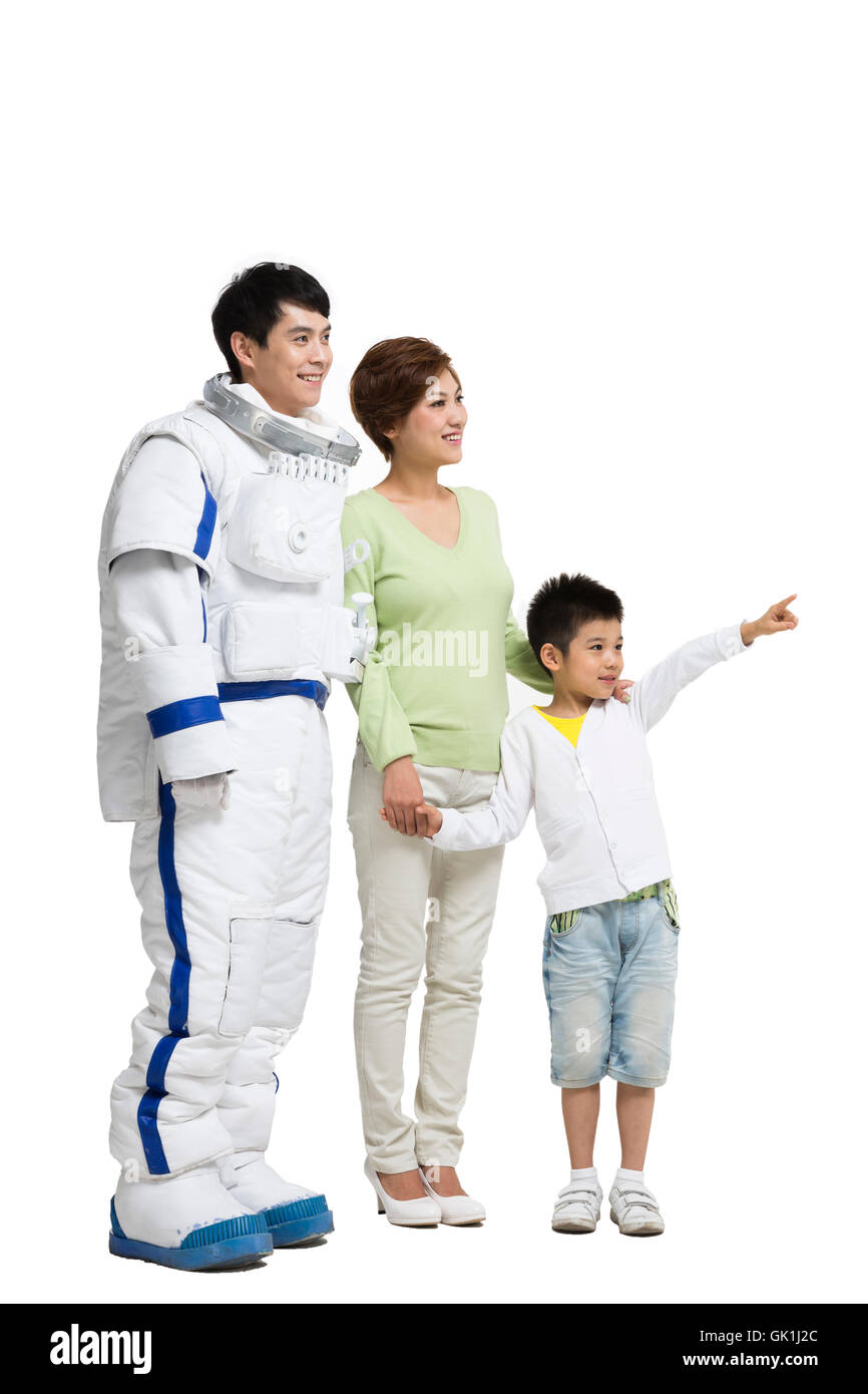 Studio shot astronauts and the little boy Stock Photo