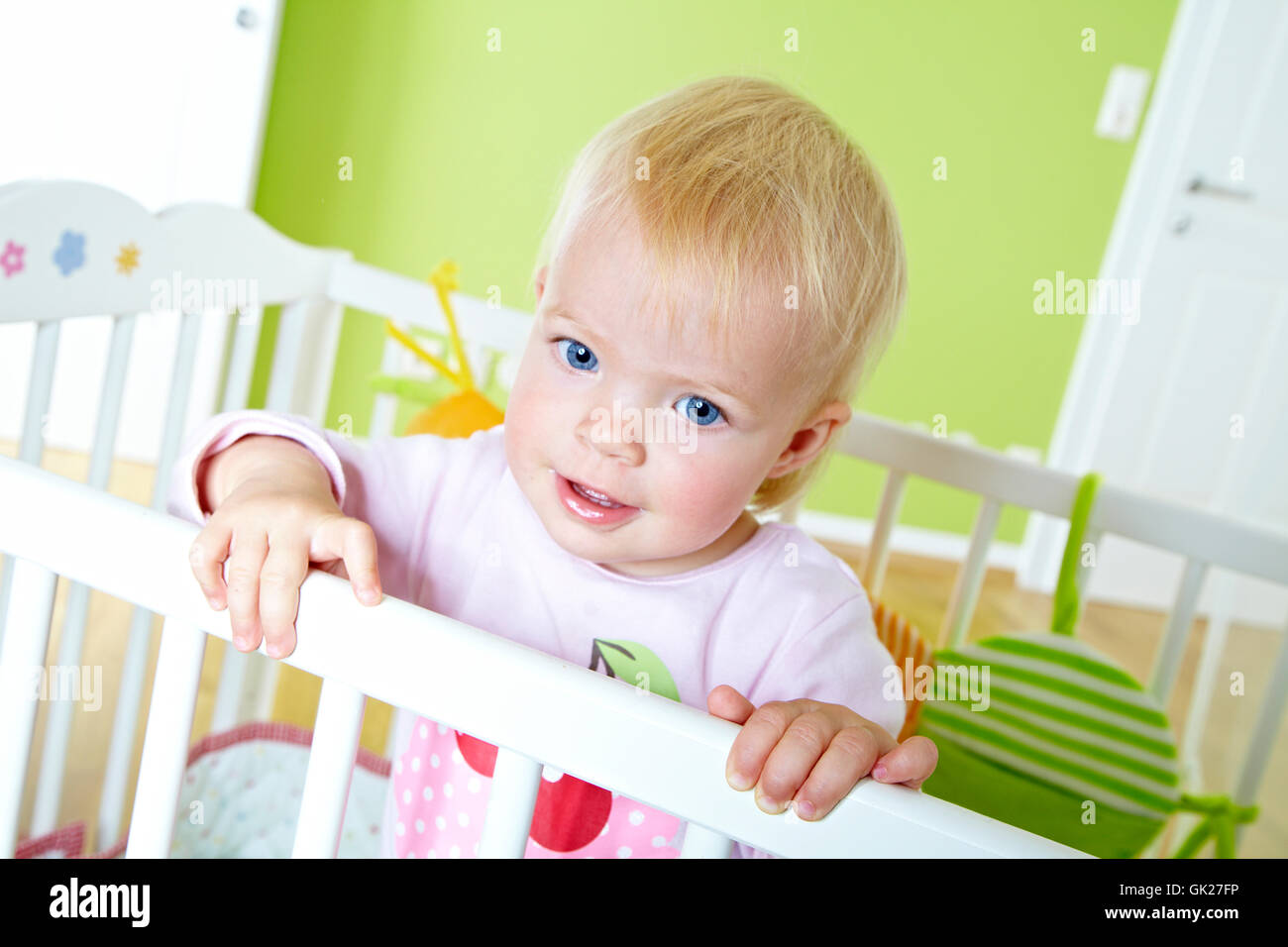 14 month old girl in the lattice bed Stock Photo Alamy
