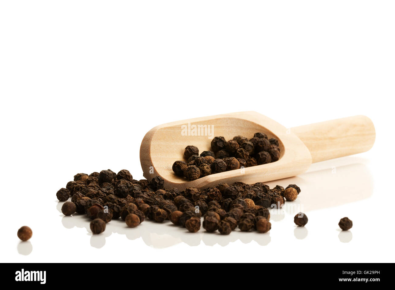 black peppercorns with wooden scoop Stock Photo