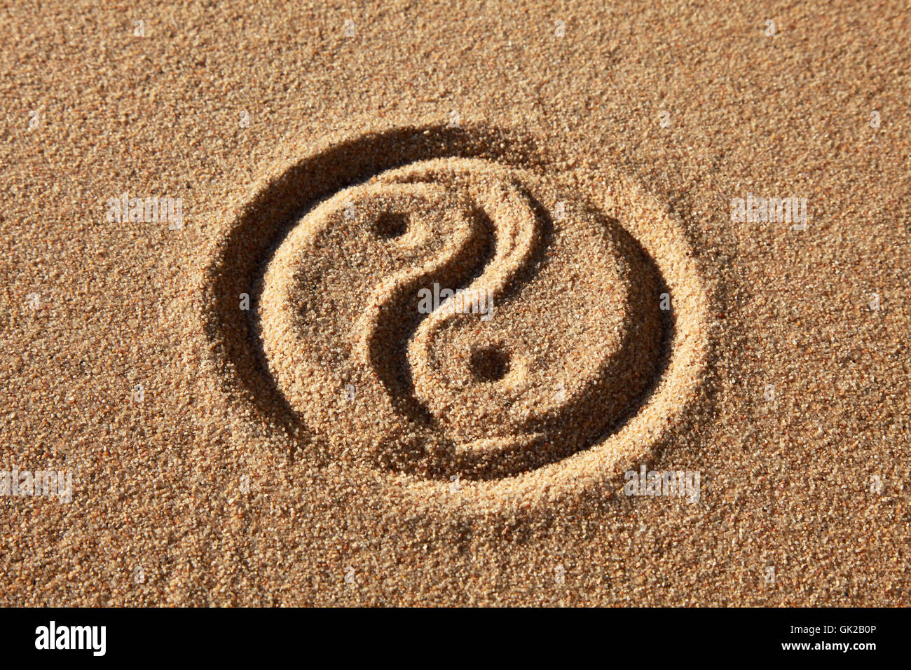yin and yang in the sand Stock Photo