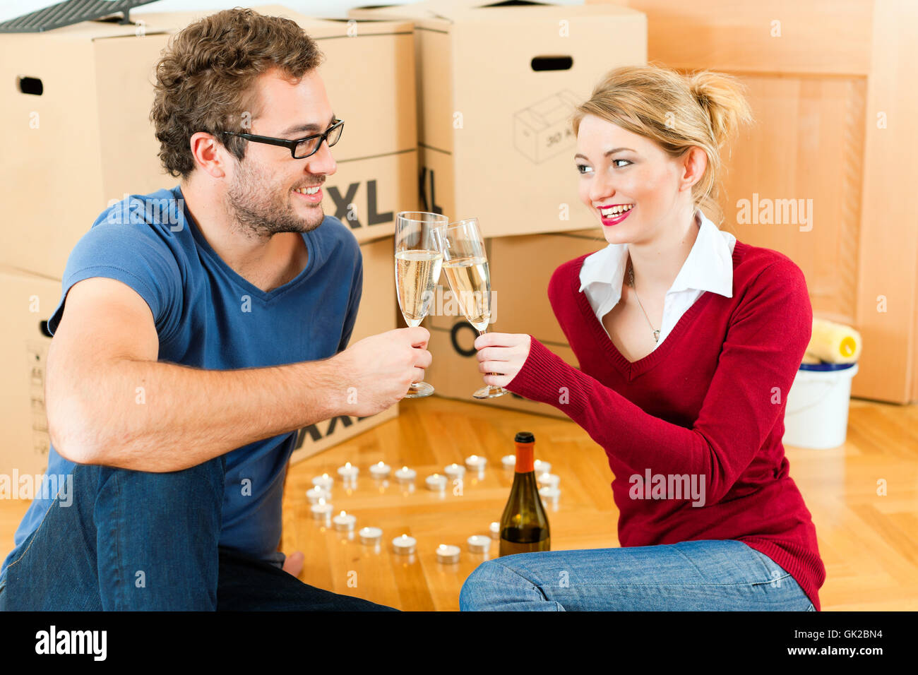 young couple takes a break when moving or e Stock Photo