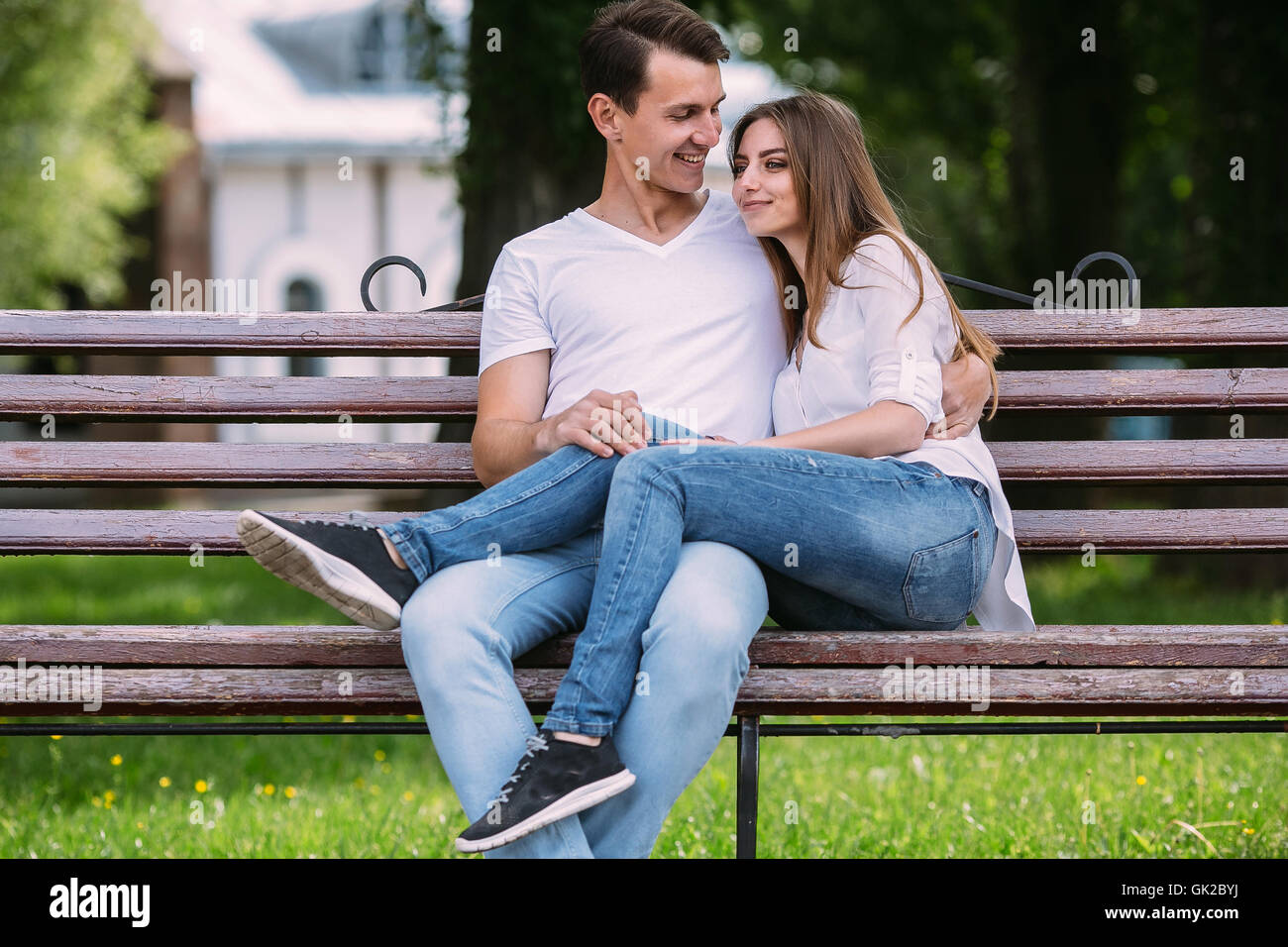 man and woman on a bench in the park Stock Photo - Alamy
