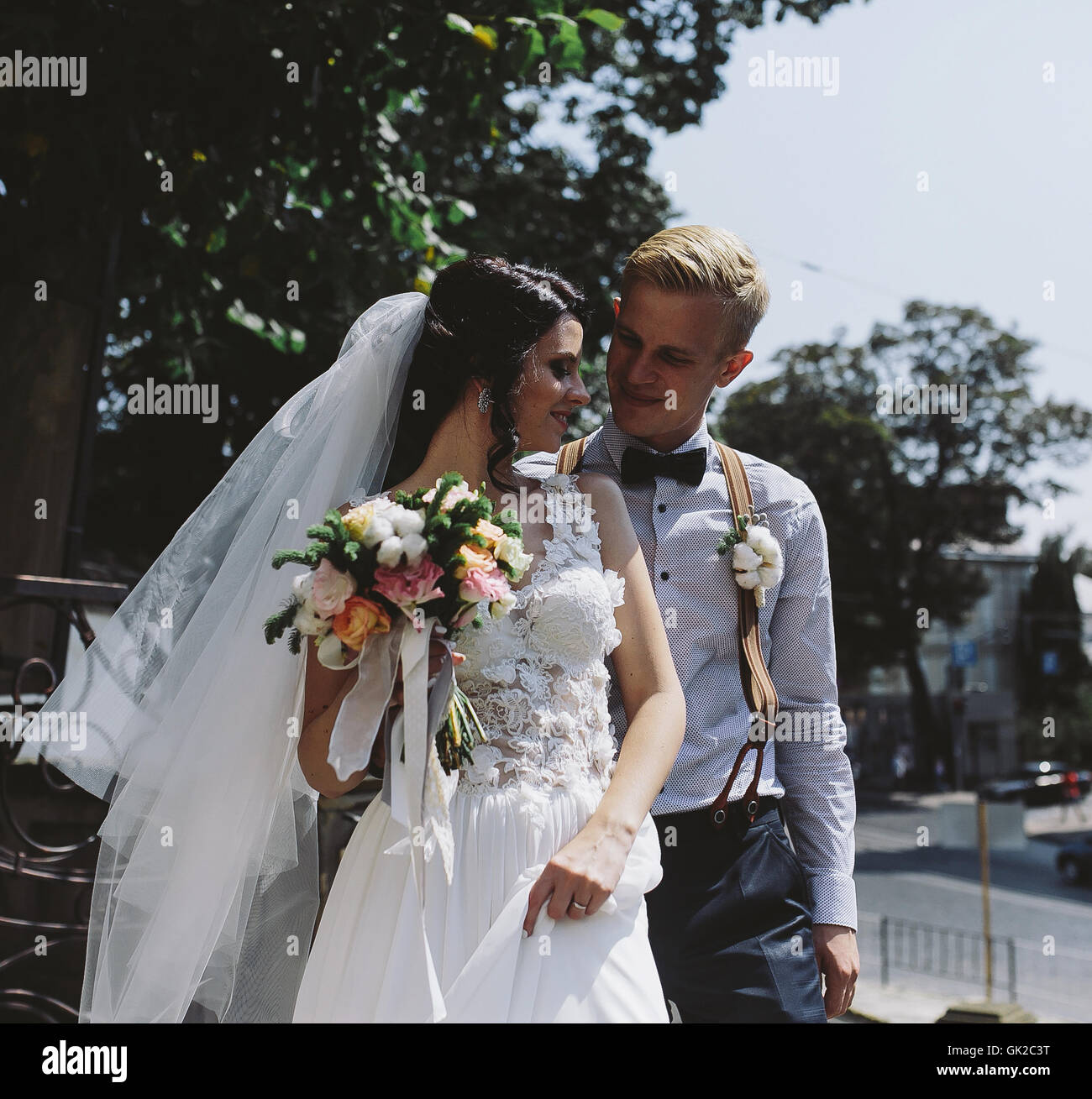 bride and groom posing on the streets Stock Photo - Alamy