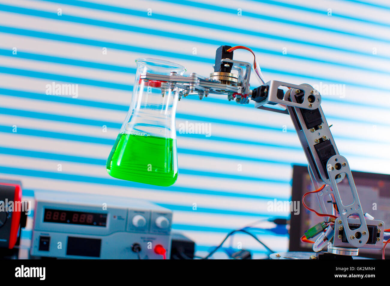 Flask in roboter arm Stock Photo